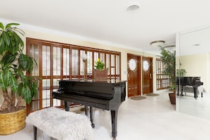 Entryway with grand piano