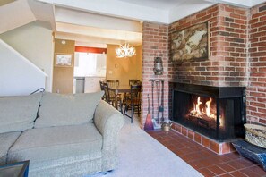 Open living area leading into dining room and kitchen