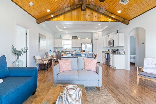 Open concept, gorgeous  living space with tall, cathedral ceiling.