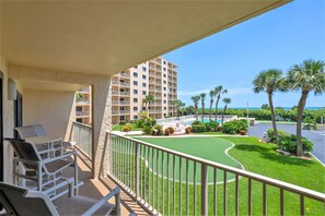 View from 1 of your 2 balconies with lush greenery and ocean breezes.
