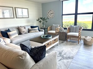 Spacious for 7. Leads onto patio, lawn and steps to soft sandy beach or pool. 