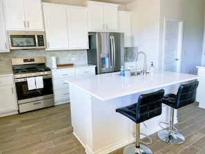 Kitchen with large counter space & GE appliances 