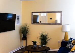 Comfort in our spacious living area, complete with large-screen entertainment.