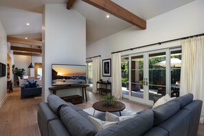 The main living room facing the 2nd living room and outdoor space.