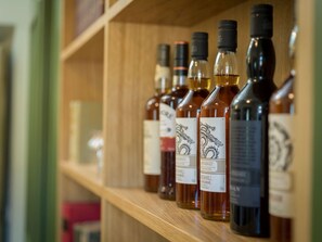 Make your favourite cocktail using the spirits provided.