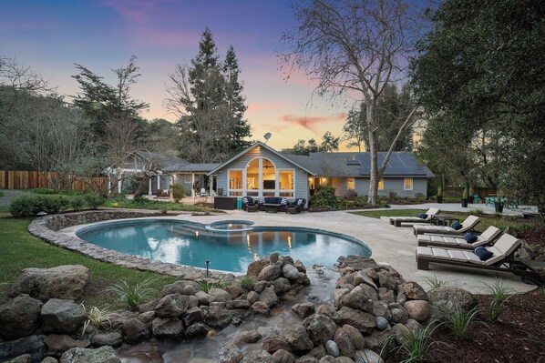 This oasis has over an acre of flat land for playing! Bocce court, pool table, outdoor dining, bar and grill pavilion, and a gas-heated pool and spa.