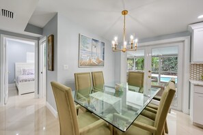 Dining Area | High Chair Available | Access to Screened-In Porch