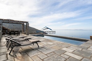 The terrace, pool and dining area all with a fantastic sea and sunset view