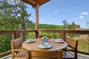 Enjoy a meal on the patio while soaking up the mountain views of the Smokies | Elkridge Cabin in Sevierville, TN