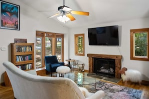 View of the living room with 55 in smart TV with streaming capabilities.  This home also has the very highest speed of fiber internet.