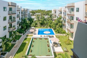 A great view of the pool & lush tropical grounds