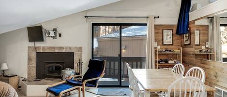 Bright studio condo. Mirrored and wood planked accent wall.