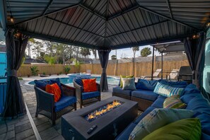 Outdoor seating w/ fireplace and smart TV