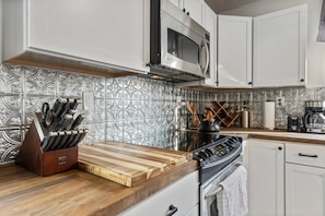 Designer Kitchen with butcher block countertops. 