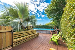 Enjoy ample seating options by the pool, perfect for entertaining and soaking up the sun.