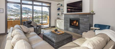 Den with gas fireplace, flat screen tv, and breathtaking views of lone peak