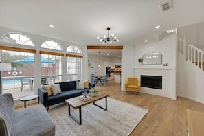 Spacious with welcoming clean lines and a modern sleek design, this living room was designed for happy moments!