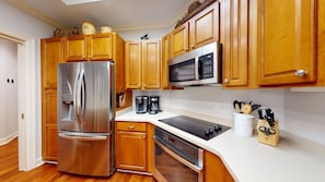 Fully Stocked Kitchen with Stainless Steel Appliances