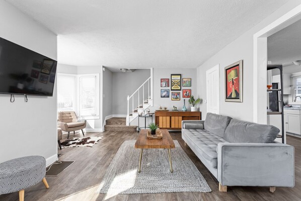 This expansive living space includes WIFI, TV, and a new sofa for kicking back and watching your favorite show or movie, or listening to your favorite artists.