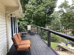 The large front deck is perfect for enjoying a morning cup of coffee