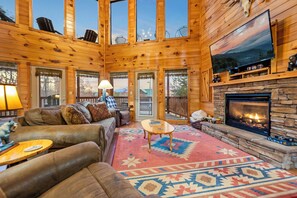 Plan your next holiday vacation with us! With massive windows from ceiling to floor, and magnificent stone fireplace.You will love spending chilly night in this space.