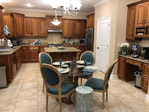 Kitchen with seating for 4; also includes a coffee/tea nook