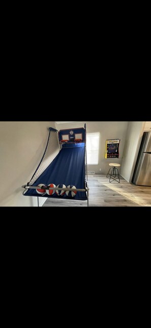 Challenge your friends to a game of Pop A Shot or Pac Man/GALAGA