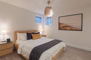 Comfortably sleeps up to 5 guests with a Queen-size bed, a futon, and a twin-size fold-out memory foam mattress