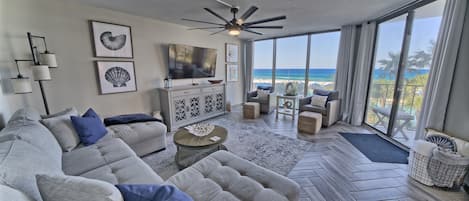 Living area has a new sleeper sofa, new smart tv and the most amazing views ever as well as beautiful modern coastal decor