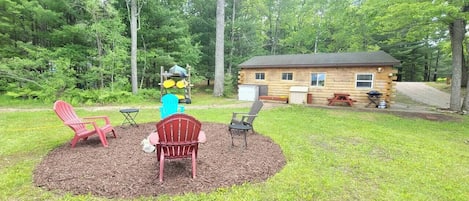 View of the fire pit toward the back of the cabin.