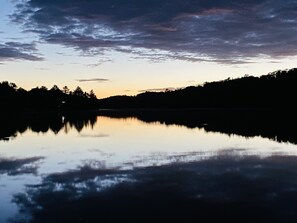 View of lake at night from beach