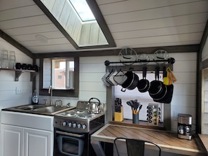 Kitchen: View of Pikes Peak in window above the sink, skylight, small oven.