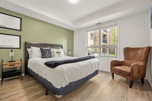 Primary bedroom with queen bed, walkthrough closet & private ensuite bathroom.