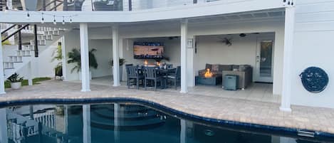 65 inch TV rotates and pulls out for viewing sports/movies from the pool
