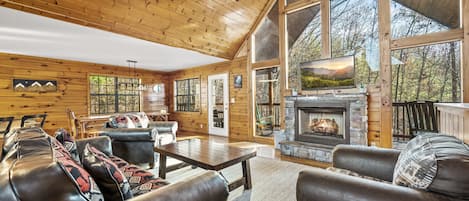 Great room w/ cozy fireplace that flows out to the back deck!