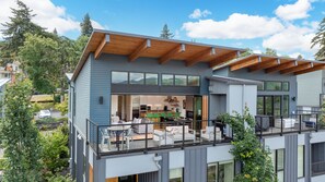 Top floor patio with folding door open to the top floor deck.