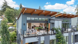 Top floor patio with folding door open to the top floor deck.
