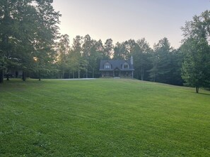 Situated against 65 wooded acres