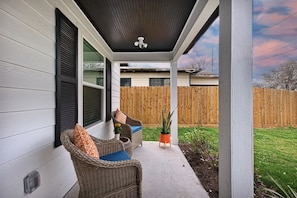 Enjoy morning coffee in the front porch, fully fenced.