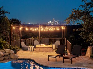 Pool area overlooks downtown skyline
