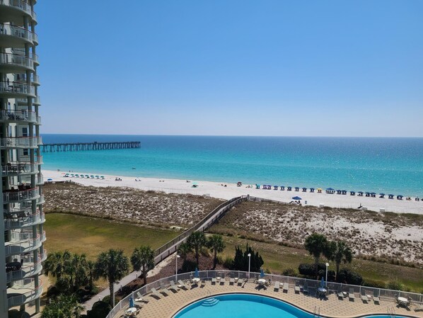 Beautiful view from the balcony looking south to the Gulf and over the pool.