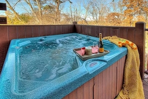 Two hot tubs, one on the upper deck and one on the mid-level deck. 