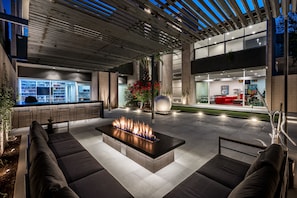 Modern Arizona retreat, The George, with a stunning outdoor lounge, cozy fire pit, and sleek open design. Perfect for evenings under the stars