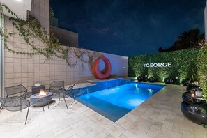 Experience luxury under the Arizona stars at The George. Featuring a modern pool, cozy fire pit, and chic design, it's the perfect retreat for relaxation and unforgettable memories.