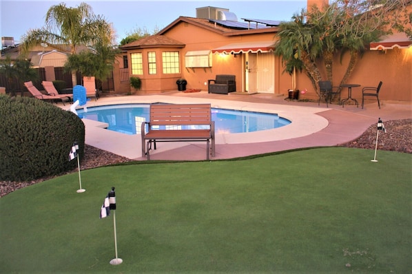 Resort yard with pool, putting green, ramada,Tv, Bluetooth stereo, fire pit,bbq 