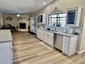 Beautiful kitchen area all new flooring and everything you see fully stocked