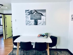 Large kitchen table with ample seating for 4 guests.