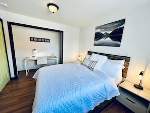 Bedroom 2 includes a workspace with desk and chair