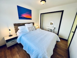 This bedroom includes a vanity.