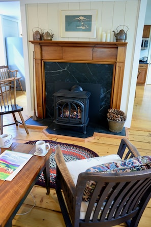 The gas stove is cosy and warm. The soapstone surround is very Vermont.